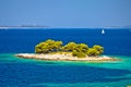 Lonely island in turquoise sea view near Primosten