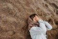 Lonely kid need parent care. Child covered his face with hands and cries