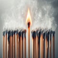 A lonely lit match among the burned-out matches. Royalty Free Stock Photo
