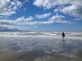 Lonely man on the beach Royalty Free Stock Photo