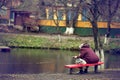 Lonely man on the bench autumn, winter