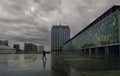 Lonely man in a city square on a rainy day