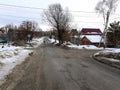 Lonely man on an empty road in winter or spring