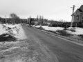 Lonely man on an empty road in winter or spring