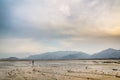 Lonely man far away on beach Royalty Free Stock Photo