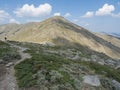 Lonely man hiker at Gennargentu Mountain, highest mountain in Sardinia, Nuoro, Italy. Vaste peaks, dry plains and valleys with Royalty Free Stock Photo