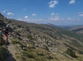 Lonely man hiker at Gennargentu Mountain, highest mountain in Sardinia, Nuoro, Italy. Vaste peaks, dry plains and valleys with Royalty Free Stock Photo