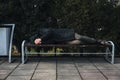 lonely man homeless and upset lies sleeping on park bench Royalty Free Stock Photo