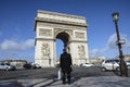 Lonely man looking at Arc de Triomphe, Paris