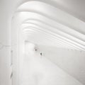 Lonely man in a perfect white passage in New York. Royalty Free Stock Photo