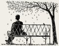 Lonely man sits on the park bench