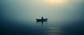 A lonely man sitting in a boat in the middle of a vast lake. Dark foggy, misty wheather, overcast. Royalty Free Stock Photo