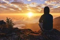 Lonely Man sitting on a mountain for watching Sunrise views alone,success and peace concept in warm