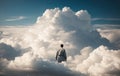 A lonely man standing with his back against the background of clouds