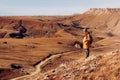 A lonely man standing in the mountains. Active vacations travel outdoor. healthy lifestyle trip in Russia North Caucasus orange ye Royalty Free Stock Photo