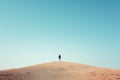 lonely man is standing on sand dunes in the desert. By generative Ai Royalty Free Stock Photo
