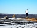 Lonely man on the top of a mountain in Kuujjuaq,