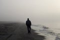 Lonely man walking on a beach