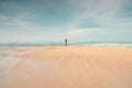 A lonely man walking on the beach. Royalty Free Stock Photo