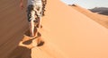 Lonely man walking on sand crest at Dune 45 in Sossusvlei desert Royalty Free Stock Photo