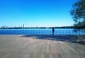 Lonely man watching river landscape background