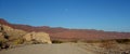 Lonely moon at dusk in the middle of desert