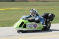 Lonely motorbike sidecar in the left turn on the track.