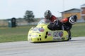 Lonely motorbike sidecar in the left turn on the track.