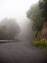 Lonely mountain road with fog Royalty Free Stock Photo
