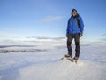 A Lonely mountaineer get rest on snowy mountain high above the c Royalty Free Stock Photo