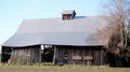 Lonely Old deserted barn, falling down in field