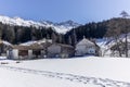 A lonely old farm on the empty and deserted ski slopes during the corona virus lockdown in the Swiss Alps Royalty Free Stock Photo