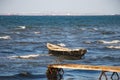 Lonely old wooden fishing boat at stormy sea Royalty Free Stock Photo