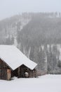 A lonely old wooden house on a hill during snowstorm in winter in south of Poland Royalty Free Stock Photo