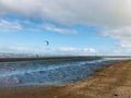 Lonely parachute in the blue sky on the morning beach Royalty Free Stock Photo