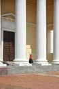 A lonely parishioner walks to the door of an Orthodox church, a beautiful architectural structure