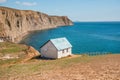 A lonely peaceful house on the edge of a cliff with a picturesque mountain landscape and a view of the Sea Royalty Free Stock Photo