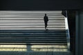 Lonely person silhouette walking upstairs Royalty Free Stock Photo