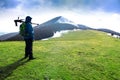 Lonely photographer in mountains