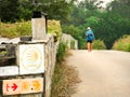 Lonely Pilgrim with backpack walking the Camino de Santiago in S