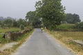 A lonely pilgrim walking in a galician village in the Camino de Santiago. Spain.