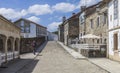 A lonely pilgrim walking in the streets of a village in Galicia, along the Camino de Santiago. Spain.