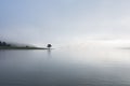 Lonely pine tree reflection on the lake at dawn part 6 Royalty Free Stock Photo