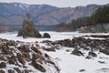 Lonely Pine tree on rock on Altai river Katun in winter. Rocks called Dragon\'s teeth, Dragon crest, or Sartakpai Arrows Royalty Free Stock Photo