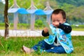 Lonely play mobile phone baby(Asia, China, Chinese) Royalty Free Stock Photo