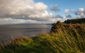 lonely and quiet cliff, cloud and Lush grass in Isle of Skye, Scotland.