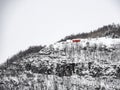 Lonely red house on the mountain in winter in Norway Royalty Free Stock Photo