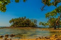 Lonely remote island with rock beach and tree when the sea water Royalty Free Stock Photo