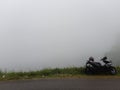 Lonely rider in foggy mountains. Royalty Free Stock Photo