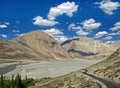 Lonely road and beautiful sky in Nubra. Royalty Free Stock Photo